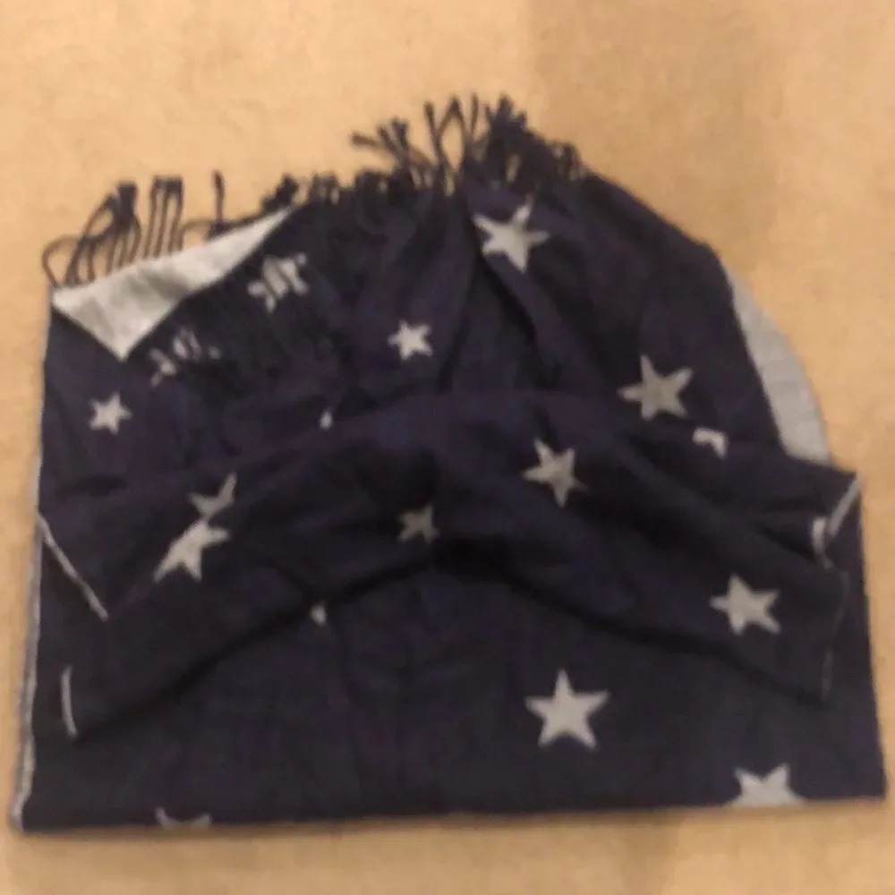 Blue scarf with grey stars on it